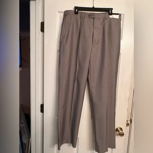 Grey Men’s slacks single pleat.  Ruff cut bottom.